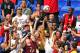 Fans try to catch a ball that was kicked into the stands during the first half of an international friendly soccer game between the New York Red Bulls and Arsenal, Saturday, June 26, 2014, in Harrison, N.J. (AP Photo/Adam Hunger)