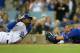 LOS ANGELES, CA - AUGUST 01: Yasiel Puig #66 of the Los Angeles Dodgers is called safe at home, as catcher Welington Castillo #5 of the Chicago Cubs reacts in the sixth inning at Dodger Stadium on August 1, 2014 in Los Angeles, California. (Photo by Jeff Gross/Getty Images)
