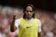 AS Monaco substitute Radamel Falcao gives a thumbs up to fans as he warms up on the sideline during the second half of the Emirates Cup soccer match between AS Monaco and Valencia at Arsenal's Emirates Stadium in London, Saturday, Aug. 2, 2014. (AP Photo/Matt Dunham)
