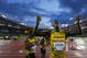 Jamaica's Usain Bolt celebrates after anchoring the Jamaican team to the gold medal in the Men's 4x100m relay at Hampden Park Stadium during the Commonwealth Games 2014 in Glasgow, Scotland, Saturday Aug. 2, 2014. (AP Photo/Frank Augstein)