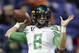 Oregon's Marcus Mariota throws to prepare for the Valero Alamo Bowl NCAA college football game against Texas, Monday, Dec. 30, 2013, in San Antonio. (AP Photo/Eric Gay)