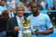 MANCHESTER, ENGLAND - MAY 11: The Manchester City Manager Manuel Pellegrini and Yaya Toure pose with the trophy at the end of the Barclays Premier League match between Manchester City and West Ham United at the Etihad Stadium on May 11, 2014 in Manchester, England. (Photo by Alex Livesey/Getty Images)