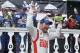 Dale Earnhardt Jr. celebrates in Victory Lane after winning the NASCAR Sprint Cup Series auto race at Pocono Raceway, Sunday, Aug. 3, 2014, in Long Pond, Pa. (AP Photo/Matt Slocum)