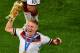 Germany's Bastian Schweinsteiger holds up the trophy as he celebrates after the World Cup final soccer match between Germany and Argentina at the Maracana Stadium in Rio de Janeiro, Brazil, Sunday, July 13, 2014. Mario Goetze volleyed in the winning goal in extra time to give Germany its fourth World Cup title with a 1-0 victory over Argentina on Sunday. (AP Photo/Francois Xavier Marit, Pool)