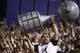Paraguay Olimpia soccer fan holds up a replica of a trophy before the first leg final of the Copa Libertadores match against Brazil's Atletico Mineiro in Asuncion, Paraguay, Wednesday, July 17, 2013. (AP Photo/Jorge Saenz)
