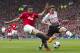 Manchester United's Robin van Persie, fights for the ball against Liverpool's Joe Allen during their English Premier League soccer match at Old Trafford Stadium, Manchester, England, Sunday March 16, 2014. (AP Photo/Jon Super)