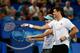 PERTH, AUSTRALIA - DECEMBER 28: Milos Raonic and Eugenie Bouchard of Canada talk inbetween play in the mixed doubles match against Sam Stosur and Bernard Tomic of Australia during day one of the 2014 Hopman Cup at Perth Arena on December 28, 2013 in Perth, Australia. (Photo by Will Russell/Getty Images)