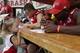 Olivia Foster, 2, of Eagle, Neb., watches as Nebraska quarterback Tommy Armstrong signs her football during the annual NCAA college football fan day in Lincoln, Neb., Friday, Aug. 1, 2014. Nebraska goes into the 2014 season looking to become relevant again nationally. The Cornhuskers finished 2013 outside the Top 25 for the first time since 2008, and they haven't ended a season in the top 10 since 2001. This year Wisconsin and Iowa are picked to finish ahead of the Huskers in the new West Division. (AP Photo/Nati Harnik)