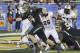 Baylor quarterback Bryce Petty (14) scores a touchdown as Central Florida defensive back Clayton Geathers (26) defends during the second half of the Fiesta Bowl NCAA college football game, Wednesday, Jan. 1, 2014, in Glendale, Ariz. (AP Photo/Matt York)