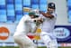 Kumar Sangakkara of Sri Lanka, right, hits the ball past Pakistan wicketkeeper Sarfraz Ahmed during the second cricket test match between Pakistan and Sri Lanka at the Dubai International Cricket Stadium in Dubai, United Arab Emirates, Sunday, Jan. 12, 2014. (AP Photo/Stephen Hindley)