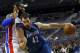 Minnesota Timberwolves power forward Kevin Love (42) drives against Detroit Pistons center Greg Monroe in the first half of their preseason NBA basketball game in Auburn Hills, Mich., Thursday, Oct. 24, 2013. (AP Photo/Paul Sancya)