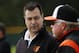Baltimore Orioles executive vice president for baseball operations Dan Duquette, left, talks with manager Buck Showalter as they watch a bullpen session on the second day of pitchers and catchers working out at the team's baseball spring training facility in Sarasota, Fla., Saturday, Feb. 15, 2014. The Orioles' first full-squad workout is set for Tuesday. (AP Photo/Gene J. Puskar)