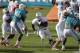 Miami Dolphins running back Lamar Miller (26) runs the ball during NFL football training camp in Davie, Fla., Monday, Aug. 4, 2014. (AP Photo/Alan Diaz)