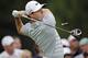 Rory McIlroy tees off on the fourth hole during the final round of the Bridgestone Invitational golf tournament Sunday, Aug. 3, 2014, at Firestone Country Club in Akron, Ohio. (AP Photo/Mark Duncan)