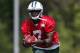 New York Jets quarterback Geno Smith runs with the ball during an NFL football organized team activity, Wednesday, June 4, 2014, in Florham Park, N.J. (AP Photo/Julio Cortez)