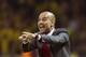 Bayern head coach Pep Guardiola of Spain gestures during the German Soccer Cup Final between FC Bayern Munich and Borussia Dortmund at the Olympic Stadium in Berlin, Germany, Saturday, May 17, 2014. (AP Photo/Gero Breloer)