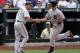 Aug 3, 2014; New York, NY, USA; San Francisco Giants catcher Buster Posey (28) is greeted by San Francisco Giants third base coach Tim Flannery (1) after hitting a two run home run during the seventh inning against the New York Mets at Citi Field. Mandatory Credit: Robert Deutsch-USA TODAY Sports