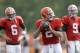 Cleveland Browns quarterback Johnny Manziel (2) gets ready to throw as quarterbacks Brian Hoyer (6) and Connor Shaw (9) watch during practice at the NFL football team's training camp Tuesday, Aug. 5, 2014, in Berea, Ohio. (AP Photo/Tony Dejak)