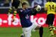 Mainz goalkeeper Loris Karius, center, holds the ball while Dortmund's Marco Reus, left, celebrates after scoring during the German first division Bundesliga soccer match between BvB Borussia Dortmund and Mainz 05 in Dortmund, Germany, Saturday, April 19, 2014. (AP Photo/Frank Augstein)