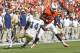 MIAMI GARDENS, FL - OCTOBER 5: Clive Walford #46 of the Miami Hurricanes runs with the ball while being defended by Jemea Thomas #14 of the Georgia Tech Yellow Jackets on October 5, 2013 at Sun Life Stadium in Miami Gardens, Florida. (Photo by Joel Auerbach/Getty Images)