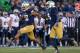 SOUTH BEND, IN - NOVEMBER 02: Eilar Hardy #16 (L) and Jaylon Smith #9 of the Notre Dame Fighting Irish celebrate a sack against the Navy Midshipmen at Notre Dame Stadium on November 2, 2013 in South Bend, Indiana. Notre Dame defeated Navy 38-34. (Photo by Jonathan Daniel/Getty Images)