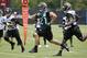 Jacksonville Jaguars running back Toby Gerhart (21) makes a move to get by Jacksonville Jaguars cornerback Dwayne Gratz, left, and linebacker LaRoy Reynolds, right, during an NFL organized team activities football practice in Jacksonville, Fla., Tuesday, May 27, 2014. (AP Photo/John Raoux)