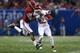 NEW ORLEANS, LA - JANUARY 02: Jalen Saunders #8 of the Oklahoma Sooners is tackled by Eddie Jackson #4 of the Alabama Crimson Tide during the Allstate Sugar Bowl at the Mercedes-Benz Superdome on January 2, 2014 in New Orleans, Louisiana. (Photo by Streeter Lecka/Getty Images)