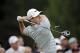 Rory McIlroy tees off on the fourth hole during the final round of the Bridgestone Invitational golf tournament Sunday, Aug. 3, 2014, at Firestone Country Club in Akron, Ohio. (AP Photo/Mark Duncan)