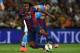 GENEVA, SWITZERLAND - AUGUST 06: Adama Traore (L) of FC Barcelona is challenged by Blerim Dzemaili of SSC Napoli during the pre-season friendly match between FC Barcelona and SSC Napoli on August 6, 2014 in Geneva, Switzerland. (Photo by Valerio Pennicino/Getty Images)