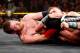 Sami Zayn locks in the Koji Clutch on Tyson Kidd.