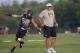 Mizzou's Shane Ray flies like an airplane behind Mizzou football coach Gary Pinkel.