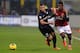 MILAN, ITALY - DECEMBER 22: Saphir Taider of FC Inter Milan (L) and Cristian Zapata of AC Milan compete for the ball during the Serie A match between FC Internazionale Milano and AC Milan at San Siro Stadium on December 22, 2013 in Milan, Italy. (Photo by Claudio Villa/Getty Images)