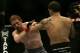 Frank Edgar (right) and Mark Bocek exchange punches at Ultimate Fighting Championship 73 on Saturday, July 7, 2007, in Sacramento, Calif. Edgar won via 1st round TKO by strikes. (AP Photo/Jeff Chiu)