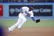 Los Angeles Dodgers shortstop Hanley Ramirez fields a ground ball hit by Los Angeles Angels Howie Kendrick but commits a throwing error allowing Erick Aybar to score during the first inning of a baseball game, Monday, August 4, 2014, in Los Angeles. (AP Photo/Danny Moloshok)