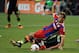 Seattle Sounders player Osvaldo Alonso takes down Bayern Munich's Xherdan Shaqiri from behind, late in the MLS All-Star Game. Alonso was booked.