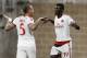 AC Milan forward Mbaye Niang (19) celebrates with Philippe Mexes after scoring in the first half a soccer match against Chivas Guadalajara at NRG Stadium Wednesday, Aug. 6, 2014 in Houston. (AP Photo/Bob Levey)