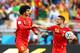 BELO HORIZONTE, BRAZIL - JUNE 17: Marouane Fellaini of Belgium (L) celebrates scoring his team's first goal with Dries Mertens during the 2014 FIFA World Cup Brazil Group H match between Belgium and Algeria at Estadio Mineirao on June 17, 2014 in Belo Horizonte, Brazil. (Photo by Ian Walton/Getty Images)
