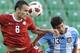 Argentina's Mateo Musacchio, right, fights for the ball with Poland's Pawel Brozek during their friendly soccer match in Warsaw, Poland, Sunday, June 5, 2011. (AP Photo/Alik Keplicz)