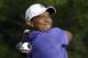 Tiger Woods watches his tee shot on the 10th hole during the first round of the PGA Championship golf tournament at Valhalla Golf Club on Thursday, Aug. 7, 2014, in Louisville, Ky. (AP Photo/John Locher)