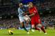 Manchester City's Maicon, left, fights for the ball against Liverpool's Daniel Agger during their English Premier League soccer match at The Etihad Stadium, Manchester, England, Sunday Feb. 3, 2013. (AP Photo/Jon Super)