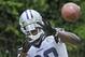Dallas Cowboys wide receiver Dez Bryant works on a catching drill during an NFL football minicamp, Wednesday, June 18, 2014, in Irving, Texas. (AP Photo/LM Otero)