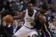 Boston Celtics shooting guard Jeff Green (8) looks to pass against Indiana Pacers small forward Paul George (24) during the first quarter of an NBA basketball game, Friday, Nov. 22, 2013, in Boston. (AP Photo/Charles Krupa)