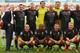 SALFORD, ENGLAND - AUGUST 07: Former Manchester United youth coach Eric Harrison, left, lines up with Gary Neville, second left, and other members of the Class of 92 squad during the match between Salford City and the Class of '92 XI at AJ Bell Stadium on August 7, 2014 in Salford, England. (Photo by Dave Thompson/Getty Images)