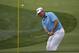 Lee Westwood, of England, hits a chip on the first hole during the first round of the PGA Championship golf tournament at Valhalla Golf Club on Thursday, Aug. 7, 2014, in Louisville, Ky. (AP Photo/David J. Phillip)