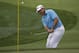 Lee Westwood, of England, hits a chip on the first hole during the first round of the PGA Championship golf tournament at Valhalla Golf Club on Thursday, Aug. 7, 2014, in Louisville, Ky. (AP Photo/David J. Phillip)