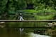 LOUISVILLE, KY - AUGUST 07: (L-R) Ian Poulter of England and and Jason Day of Australia walk across a bridge to the second tee during the first round of the 96th PGA Championship at Valhalla Golf Club on August 7, 2014 in Louisville, Kentucky. (Photo by Jeff Gross/Getty Images)