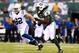 EAST RUTHERFORD, NJ - AUGUST 07: Running back Chris Johnson #21 of the New York Jets carries the ball against outside linebacker Bjoern Werner #92 of the Indianapolis Colts during a preseason game at MetLife Stadium on August 7, 2014 in East Rutherford, New Jersey. (Photo by Elsa/Getty Images)