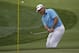 Lee Westwood, of England, hits a chip on the first hole during the first round of the PGA Championship golf tournament at Valhalla Golf Club on Thursday, Aug. 7, 2014, in Louisville, Ky. (AP Photo/David J. Phillip)