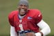 Carolina Panthers' Cam Newton laughs as he runs up the field during an NFL football practice at their training camp in Spartanburg, S.C., Friday, Aug. 1, 2014. (AP Photo/Chuck Burton)