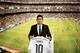 New Real Madrid player James Rodriguez, from Colombia, holds his new shirt and poses for photographers during his official presentation at the Santiago Bernabeu stadium in Madrid, Spain, Tuesday, July 22, 2014, after signing for Real Madrid. Real Madrid have signed Rodriguez from Monaco on a six-year contract. (AP Photo/Daniel Ochoa de Olza)